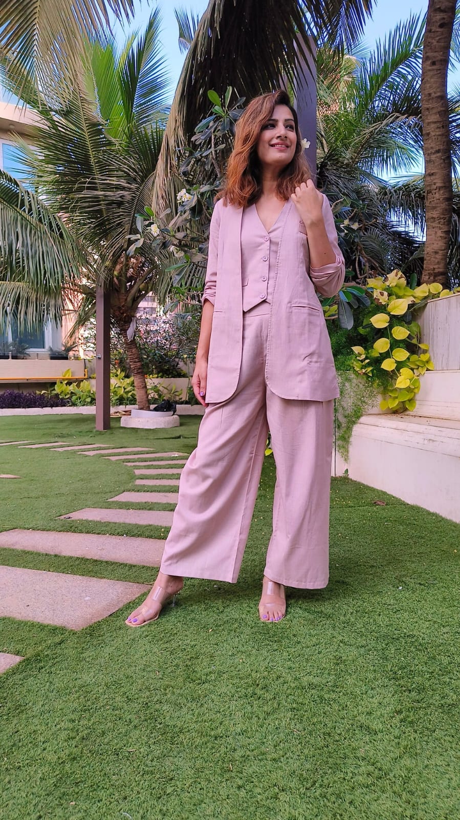 Bell-Bottoms Paired with a Sleek Halter Vest and Blazer